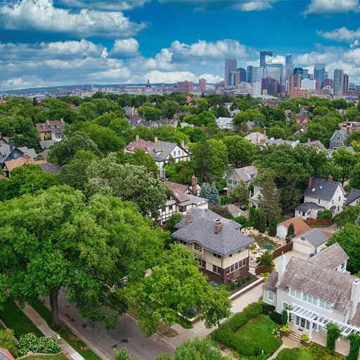 Crystal, MN – tree-lined neighborhood with the Minneapolis skyline beyond