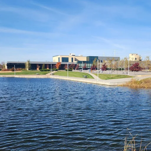 Fridley, MN – civic campus beside a pond on a clear day
