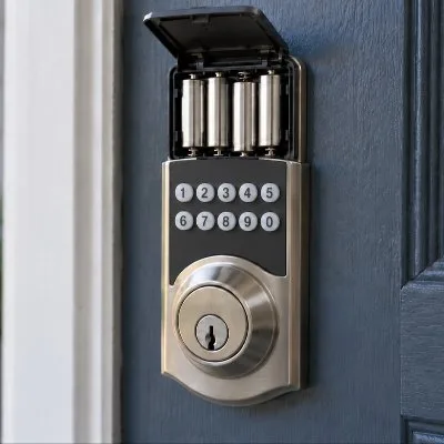 Keypad deadbolt on a front door with the battery cover open and the key cylinder visible.